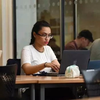 female student working on laptop