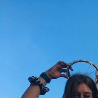 Iris standing in front of a castle smiling