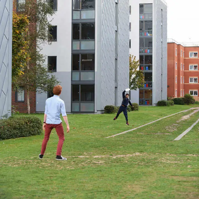 students playing frisbee