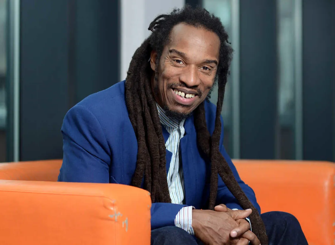 Benjamin Zephaniah on orange sofa