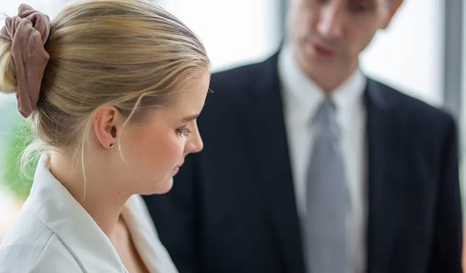 Envato-Closeup-on-business-woman-face-discussing-with-man-920