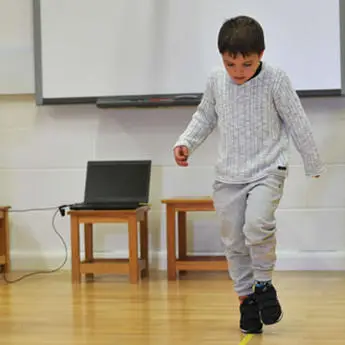 children walking in a straight line