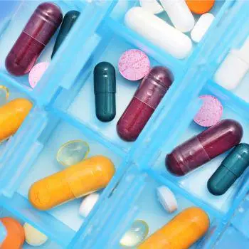 a selection of different medications in a blue container