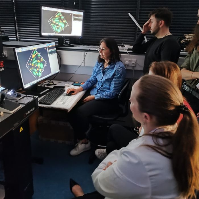 researchers in a bio-imaging suite