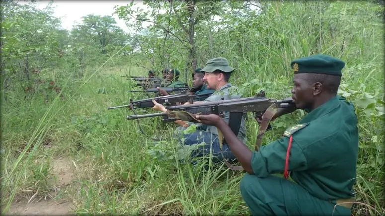 Research team member Luke Townsend doing intelligence training with local rangers