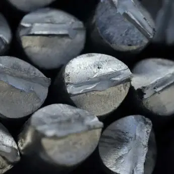 Close-up of silver-gray metal ingots with rough textures.