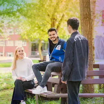 group of students chatting in the park v2